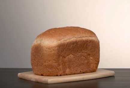 Loaf of bread on cutting board