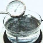 Pot of boiling water with thermometer