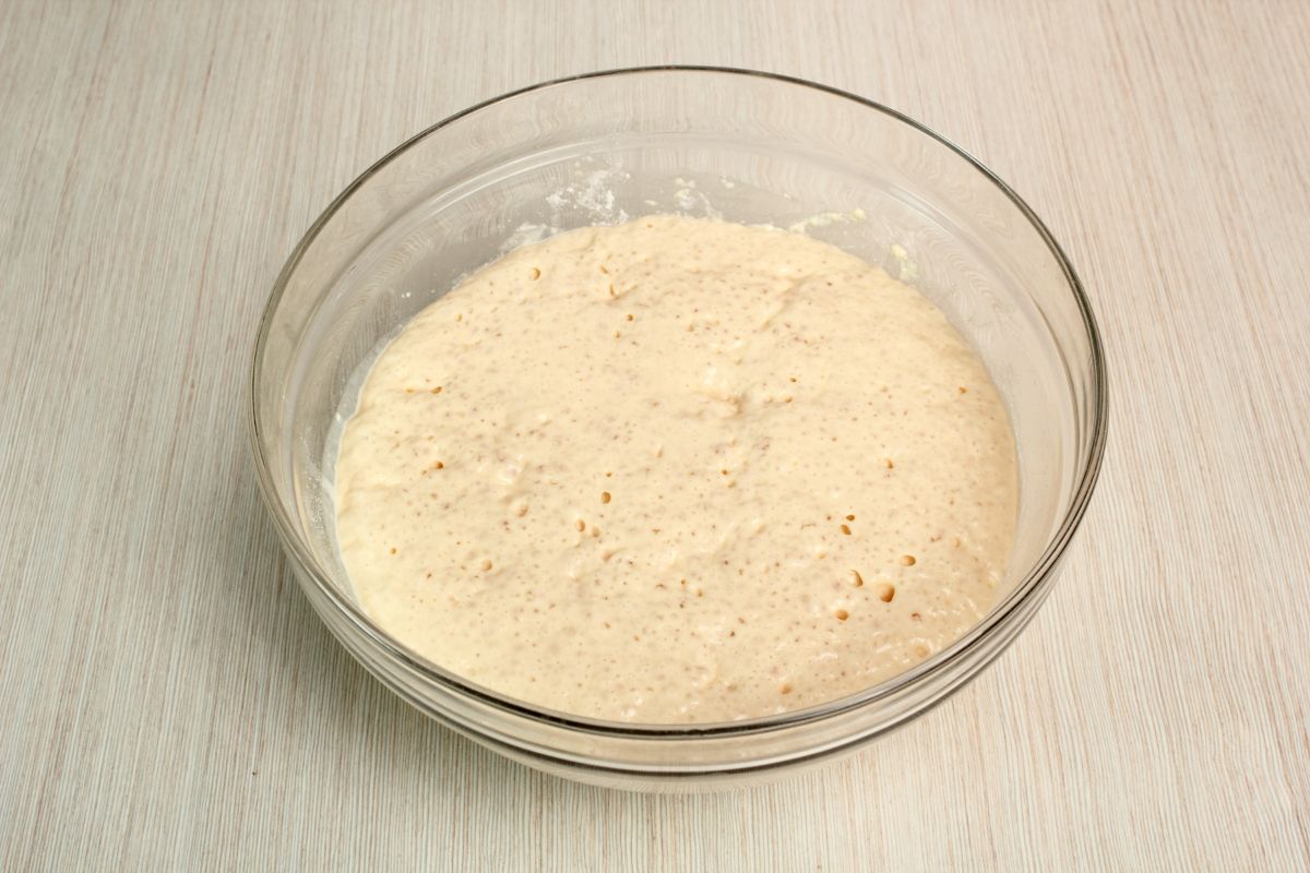 Glass bowl of proofed active yeast on table