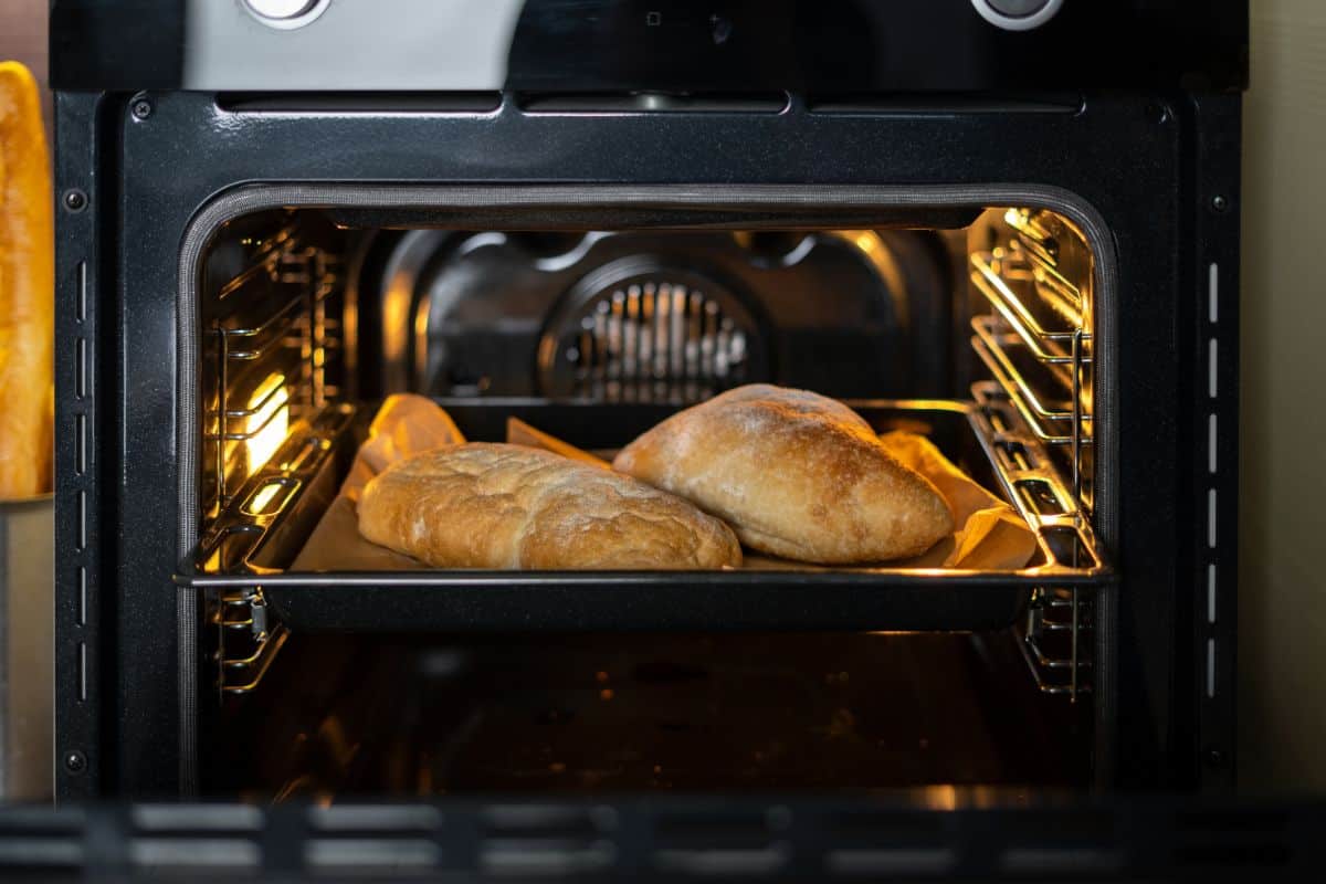 Baking oven with loafs of bread inside