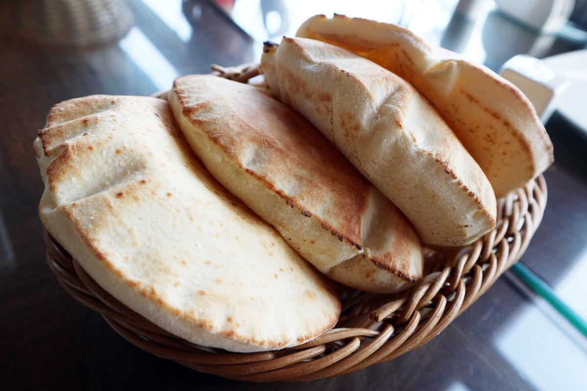 Bunch of pita bread in wooden basket